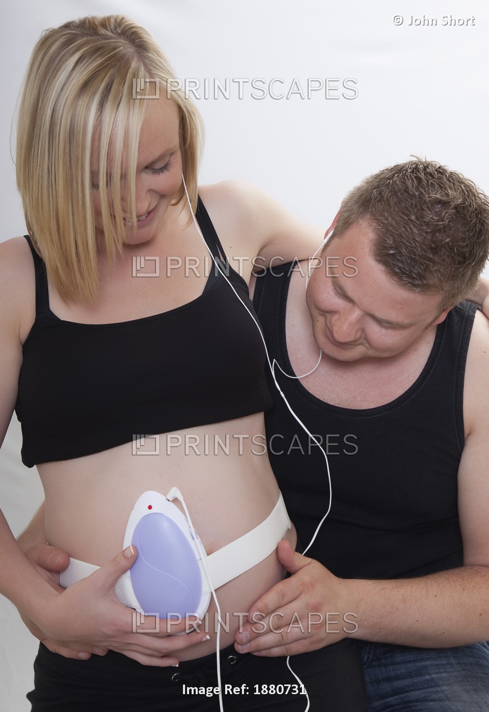 A Pregnant Couple Listening To A Baby's Heart Beat; Tyne & Wear, England