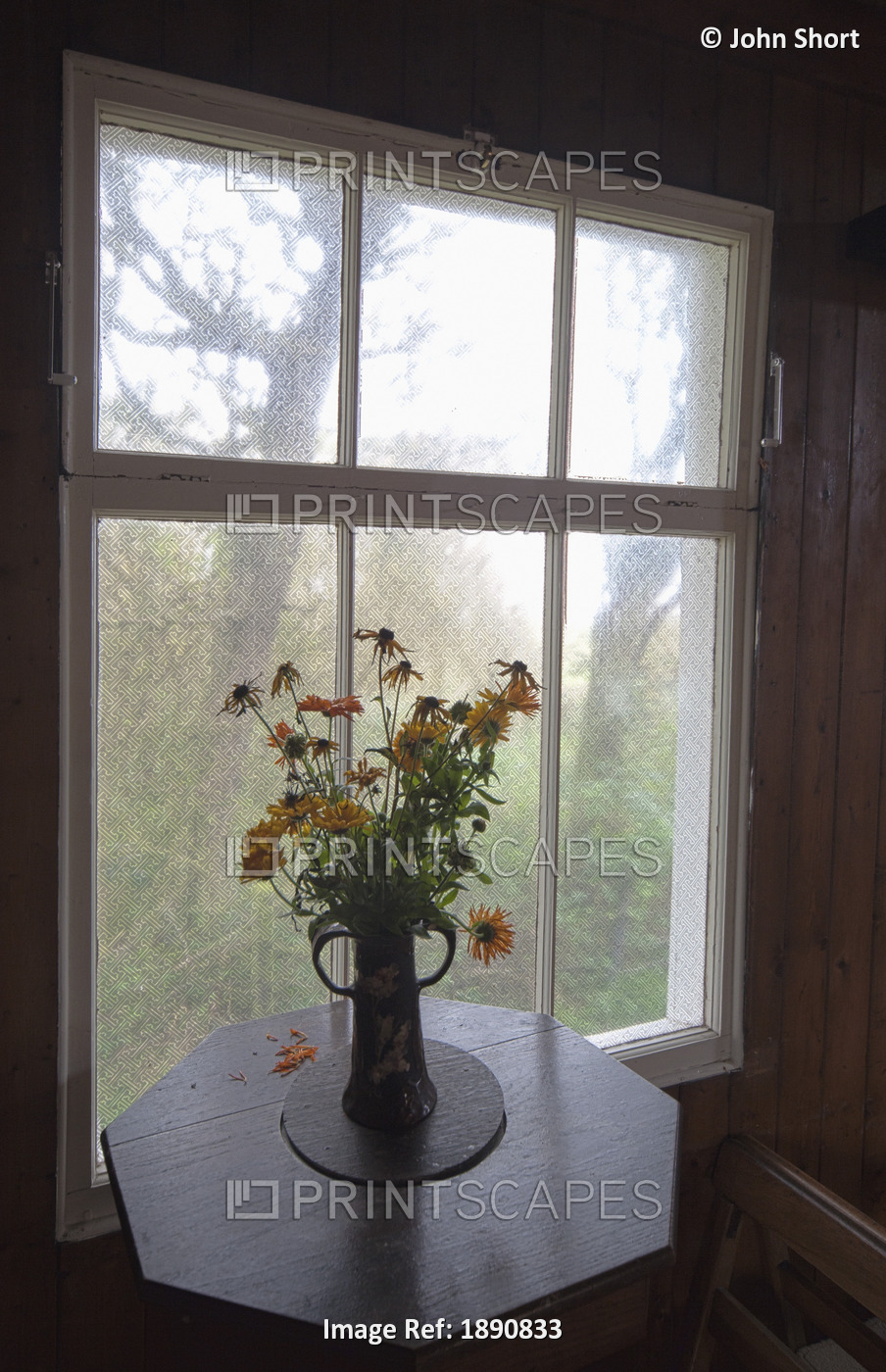 A Bouquet Of Flowers In A Vase On A Table By The Window; Northumberland, England