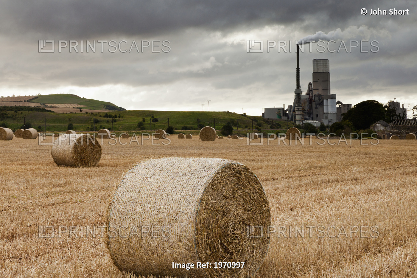 A Cement Production Plant With Hay Bales In A Field In The Foreground; Lothian ...