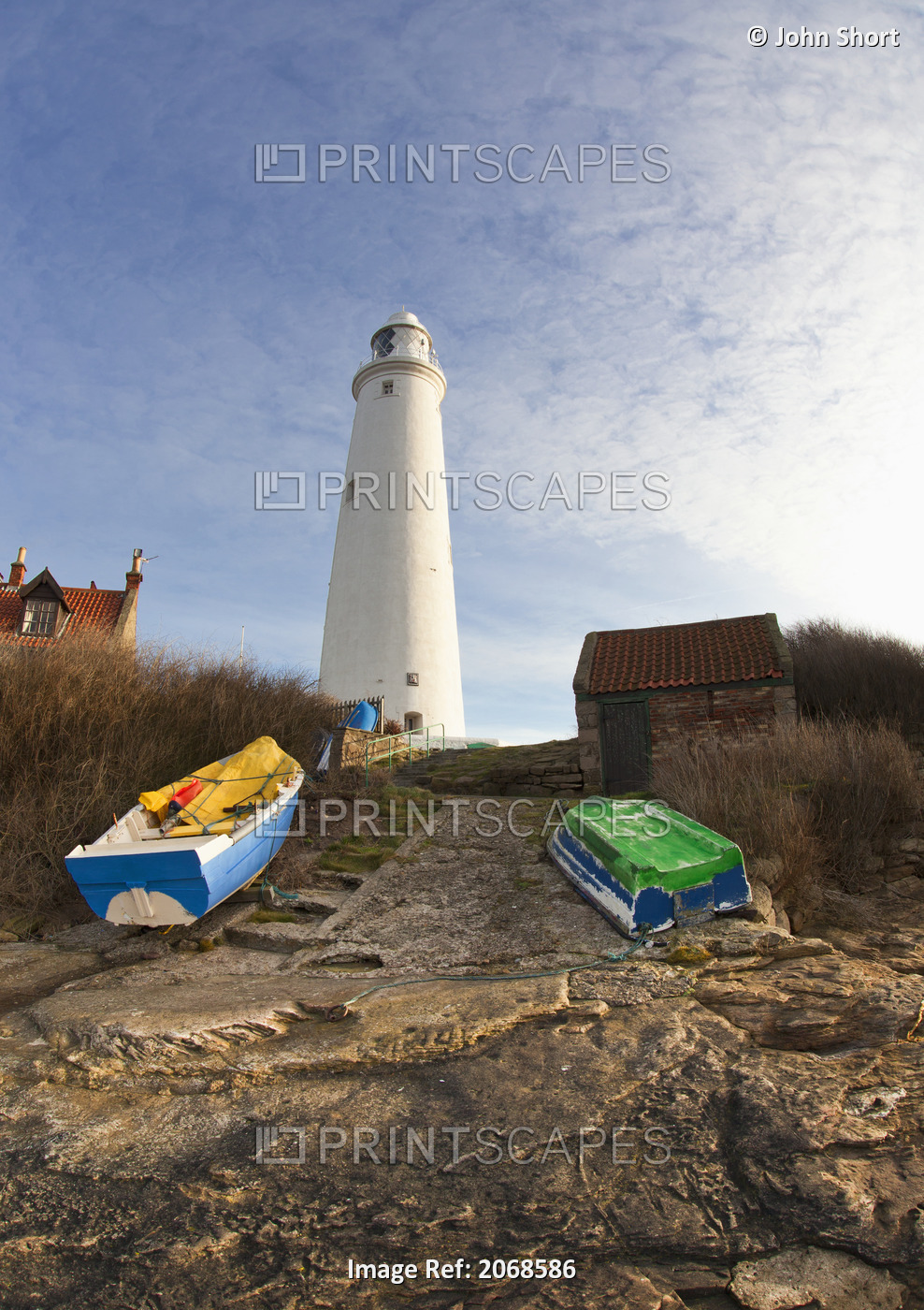 Rowboats Abandoned On The Shore In Front Of The Lighthouse On St. Mary's ...