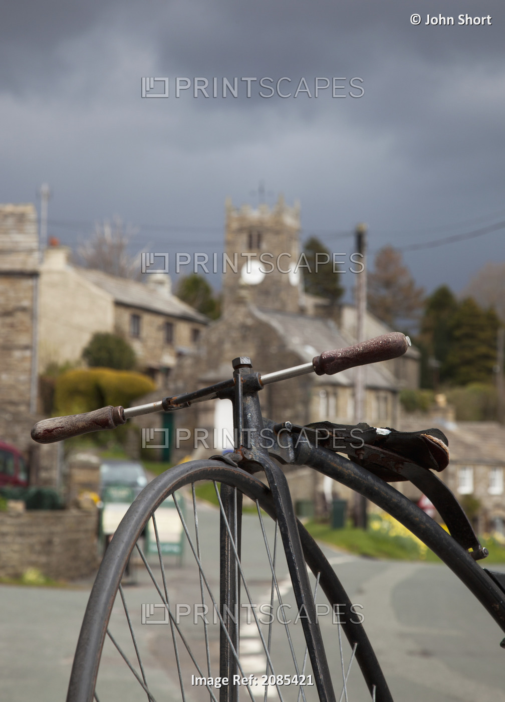 A Bicycle In The Foreground With Houses In The Background; Muker Village ...