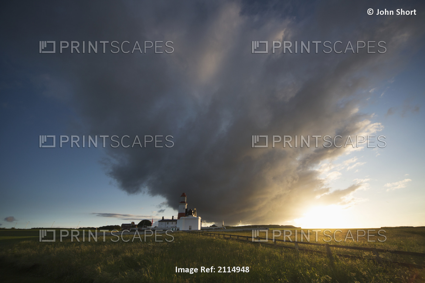 Souter lighthouse with a cloud formation above it at sunrise;South shields tyne ...