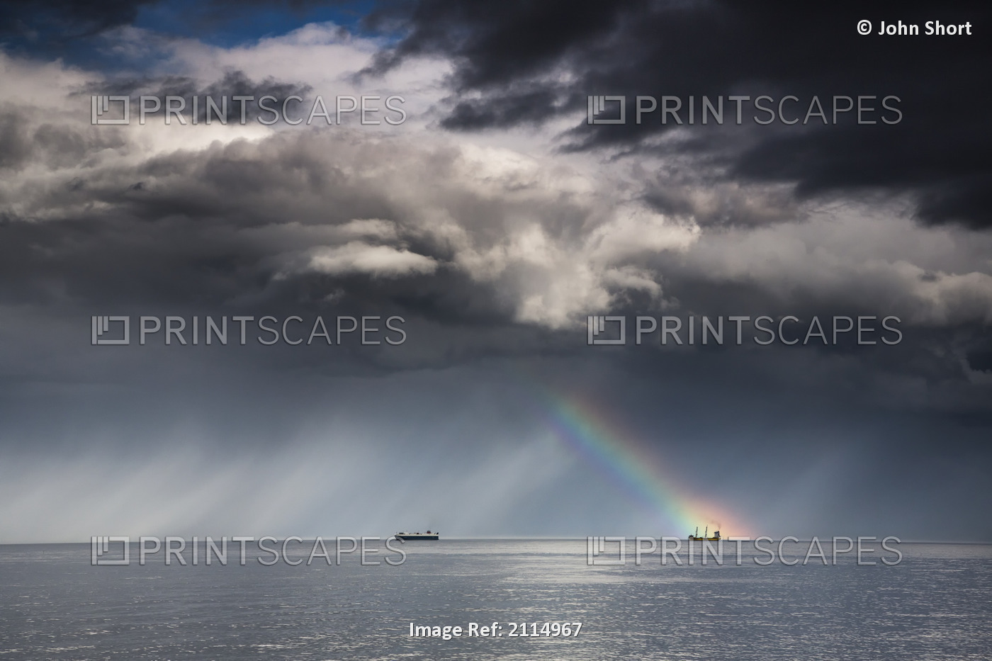 A Rainbow Through Storm Clouds Over An Ocean With Two Ships; Whitley Bay ...