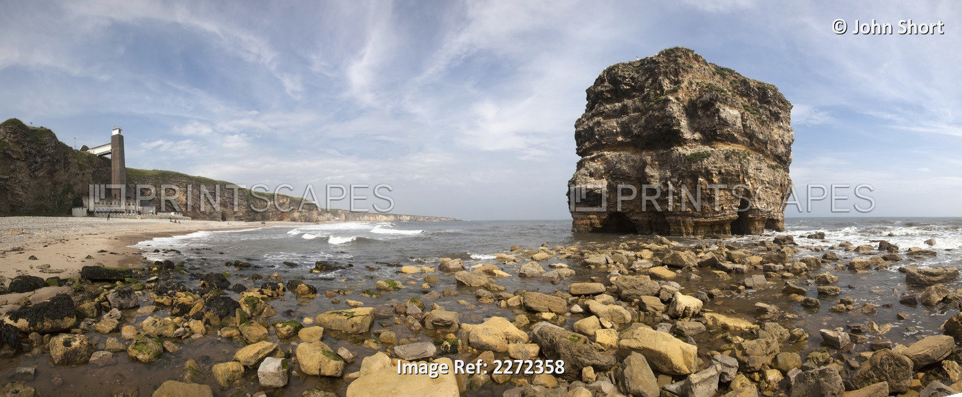 Large rock formation along the coastline at low tide;South shields tyne and ...