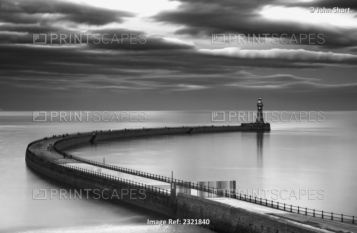 A curving pier with a lighthouse at the end;Sunderland tyne and wear england