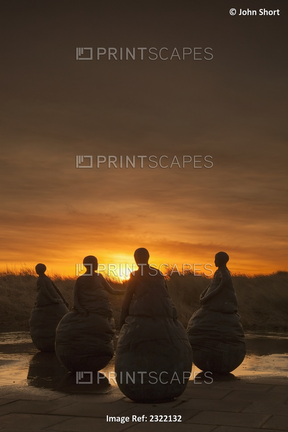 UK, England, Tyne and Wear, South Shields, Four female statues at sunset