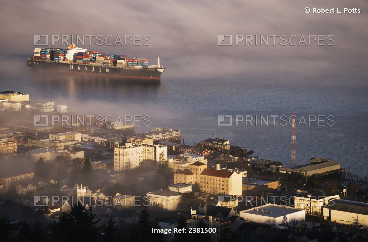 A Container Ship Emerges From The Fog; Astoria, Oregon, United States Of America
