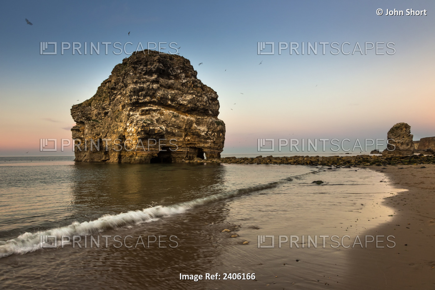 A Large Rock Formation On The Coast At Sunset; South Shields, Tyne And Wear, ...