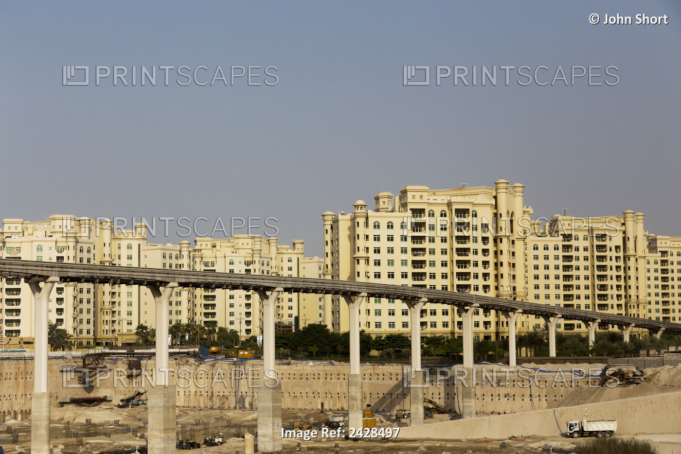 Residential Buildings And A Construction Site Under A Roadway; Dubai, United ...