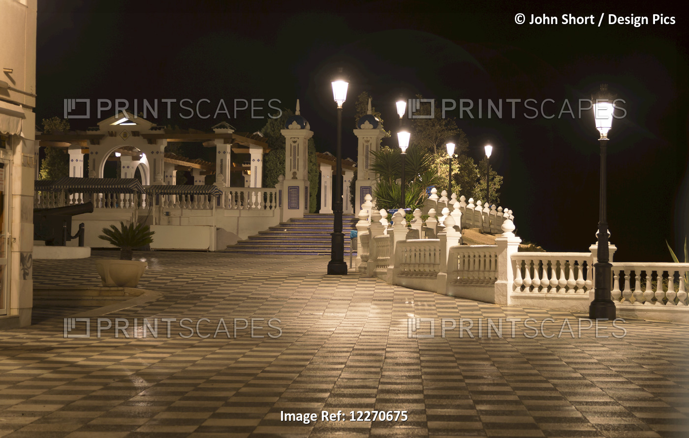 Lampposts Illuminated Along The Promenade At Nighttime; Benidorm, Spain