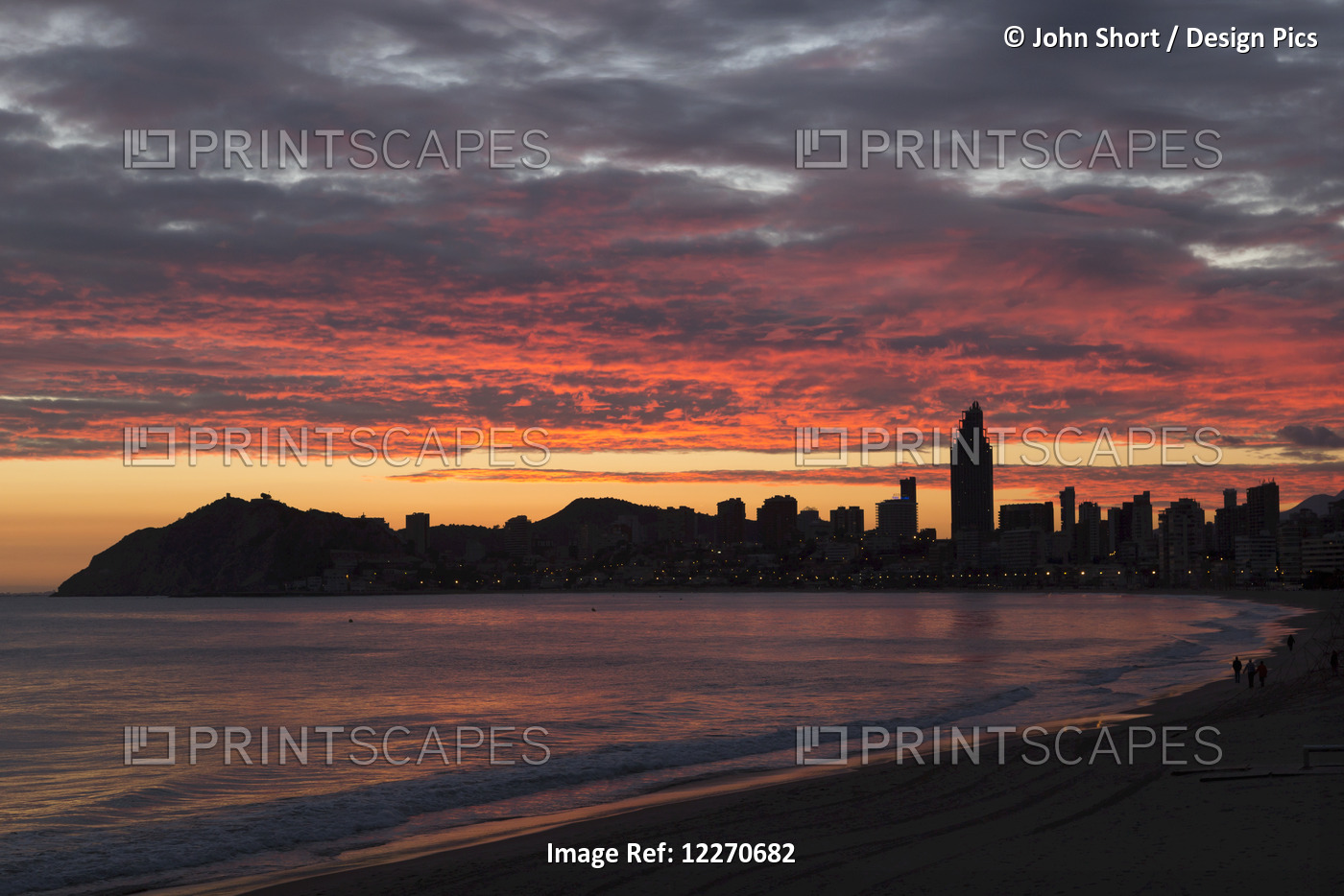 Colourful Dramatic Sunset Over The Silhouetted Skyline; Benidorm, Spain