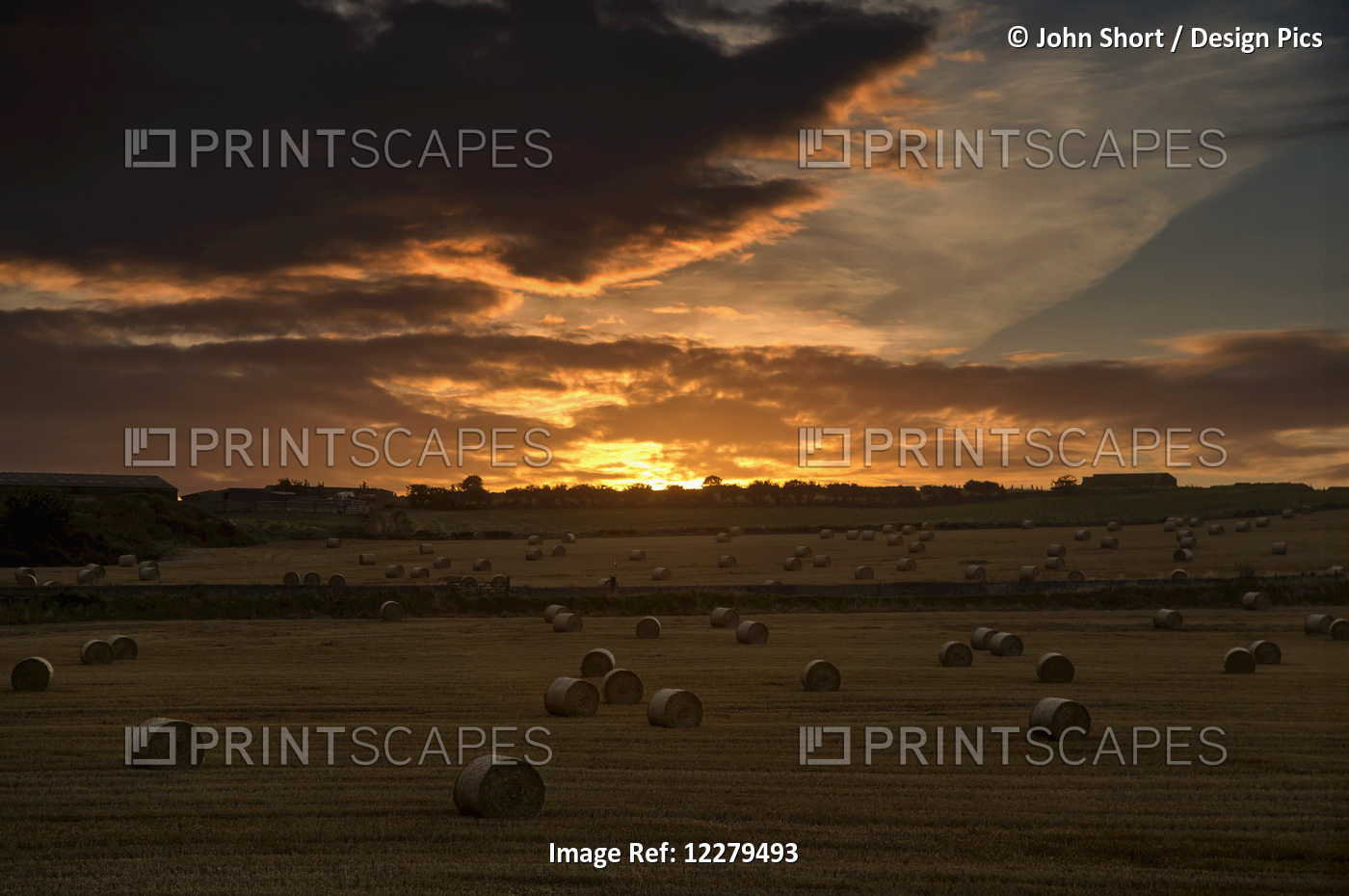 Dramatic Sunset With Dark Clouds Over A Field With Hay Bales; Whitburn, Tyne ...
