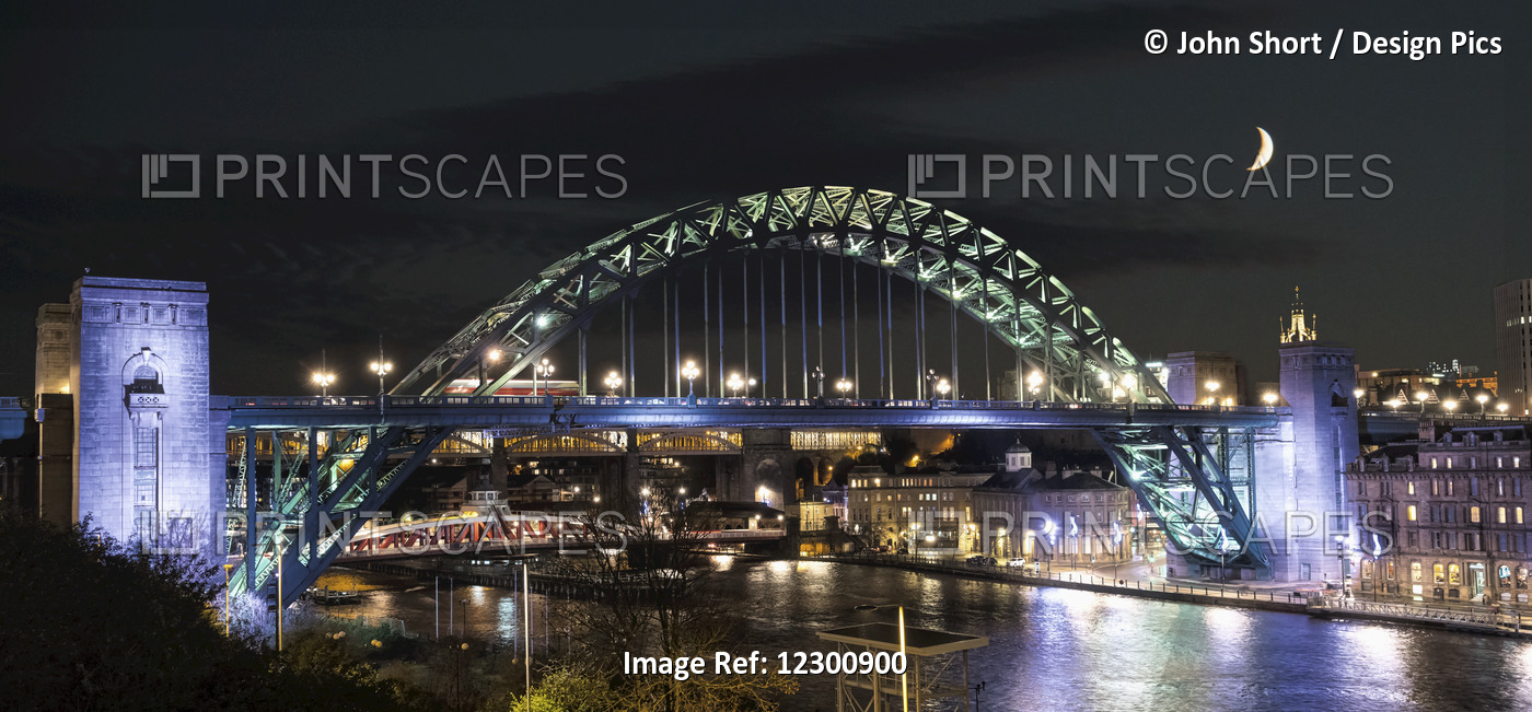 Tyne Bridge Illuminated At Nighttime Over River Tyne With A Crescent Moon In ...
