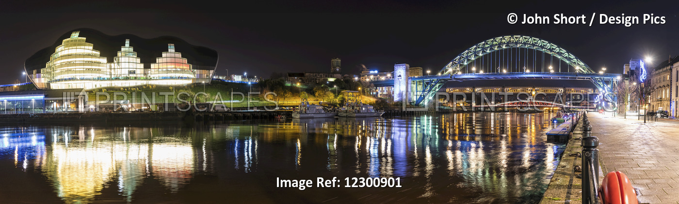 Tyne Bridge Illuminated At Nighttime Over River Tyne And Illuminated Buildings; ...