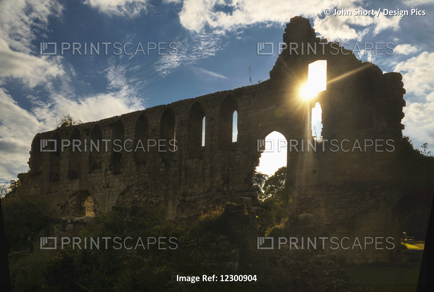 Ruins Of Jeraulx Abbey With Sunlight Shining Through A Window; Yorkshire Dales, ...