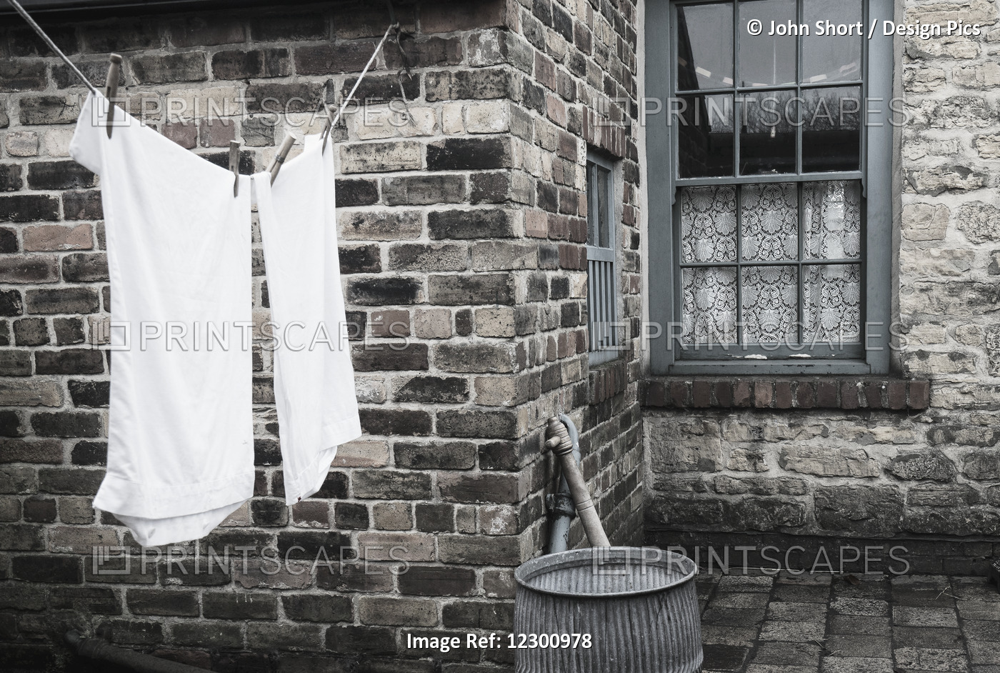 Stone Walls Of A House With Laundry Hanging To Dry On The Clothesline; Beamish, ...