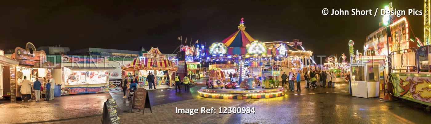 Rides Illuminated In An Amusement Park At Nighttime; Sunderland, Tyne And Wear, ...