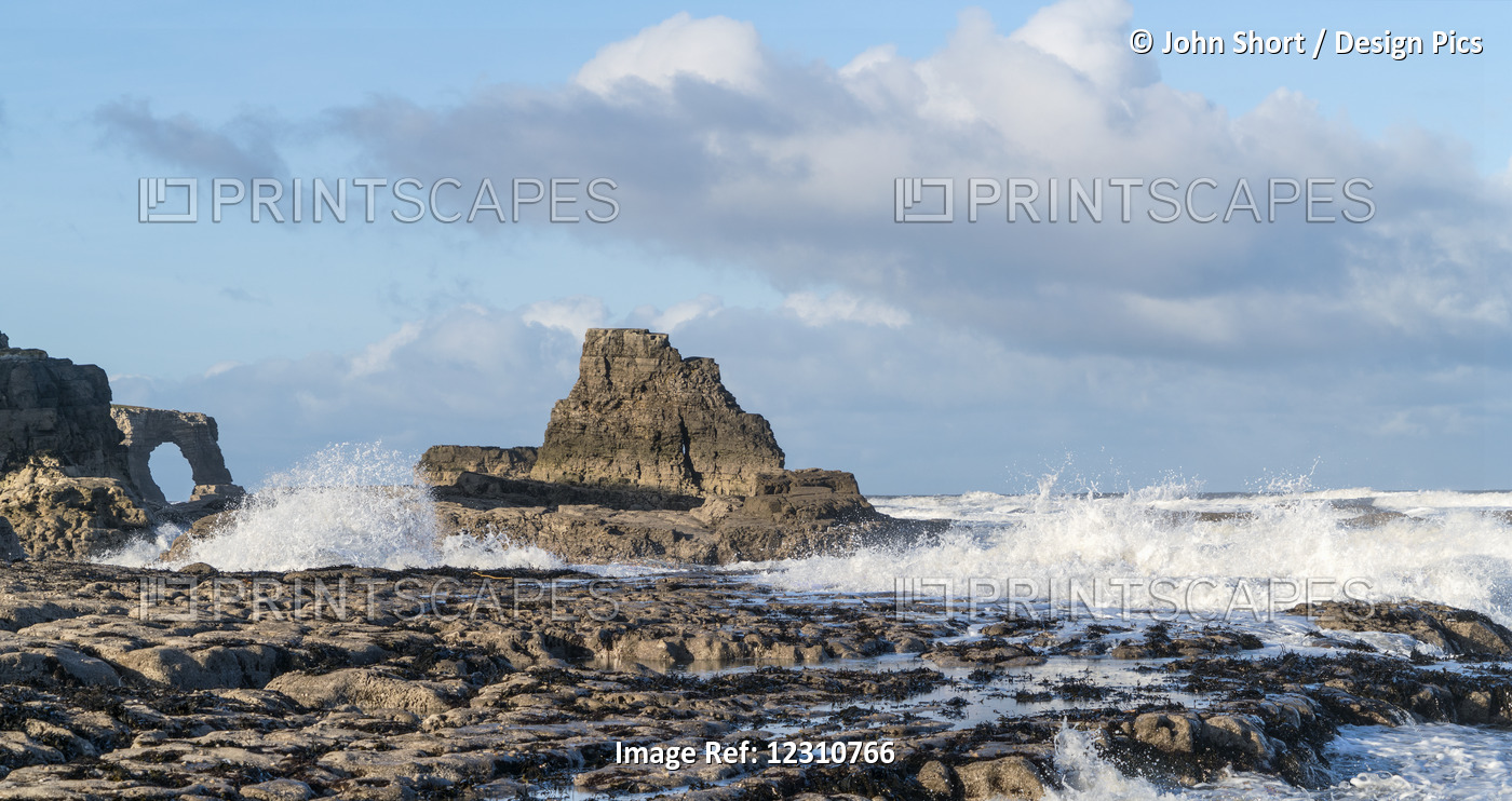 Waves Splashing Onto The Rock Formations On The Coast; South Shields, Tyne And ...