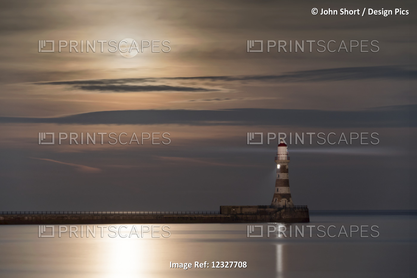 Roker Lighthouse Glowing At The End Of A Pier Under A Bright Full Moon ...