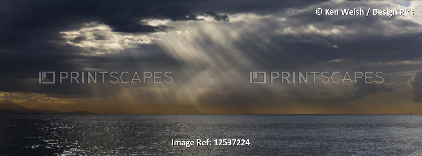Storm approaching over sea with a glowing horizon; Spain
