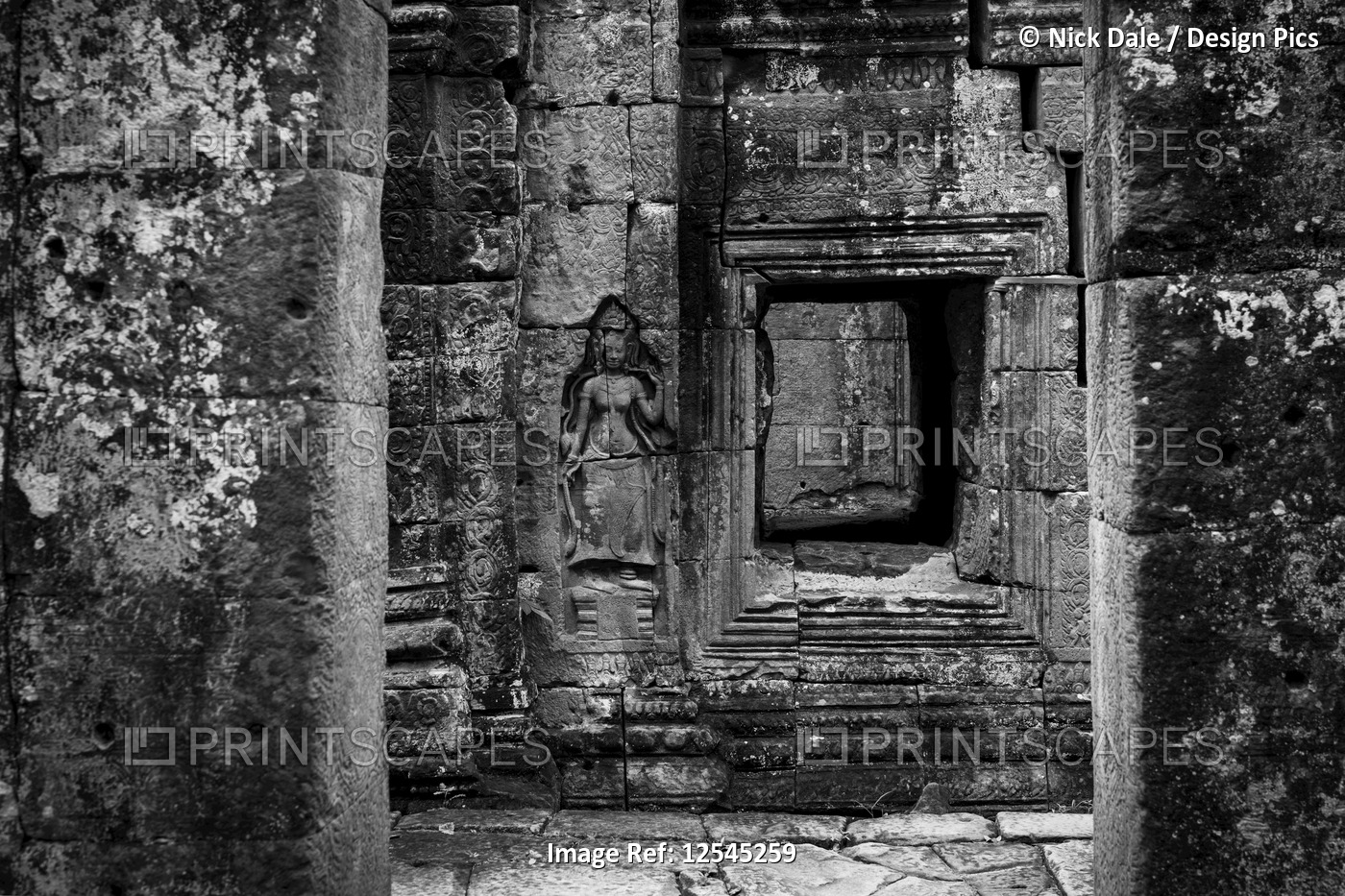 Monochrome bas-relief of crowned woman beside window, Banteay Kdei, Angkor Wat; ...