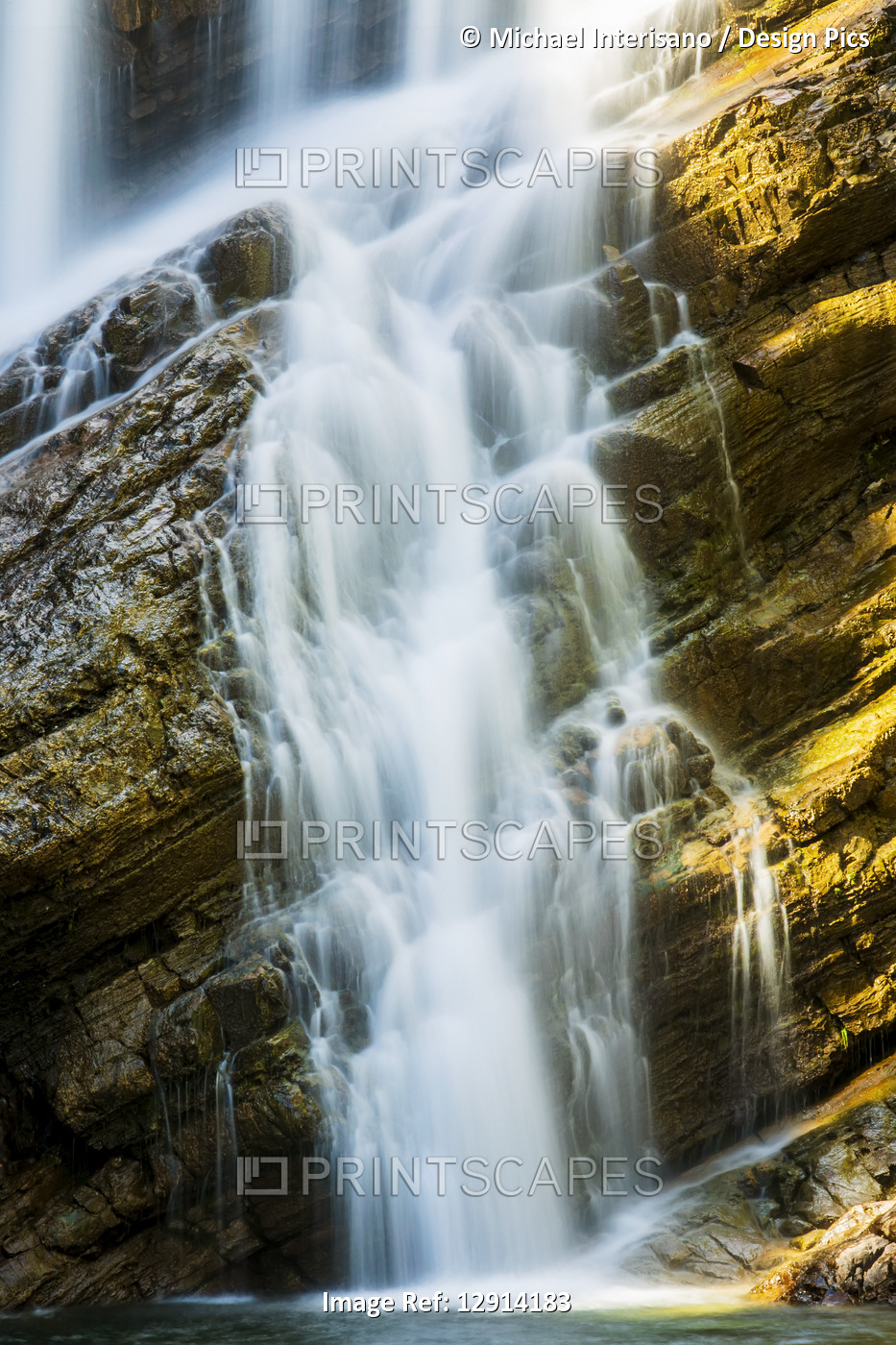 Close-up of waterfalls on angled rocky cliff, Waterton Lakes National Park; ...