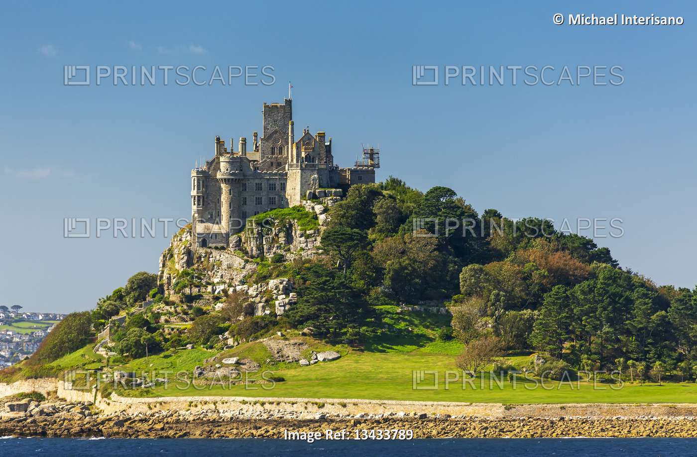 Castle of St. Michael perched on top of a rocky hill along a shoreline, ...