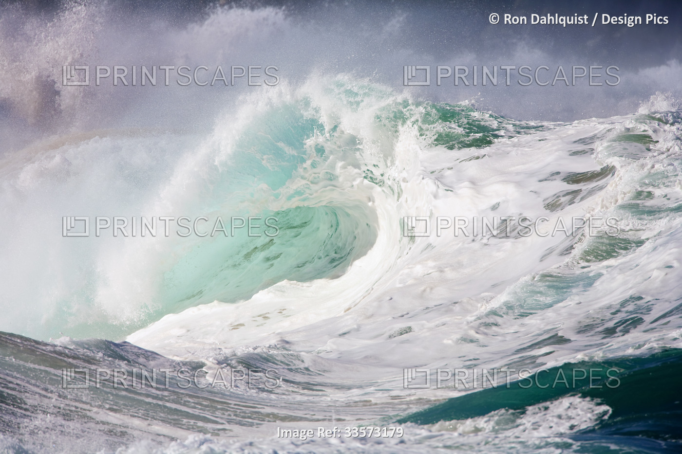 Large winter surf with foamy waves breaking on the north shore of Oahu at ...
